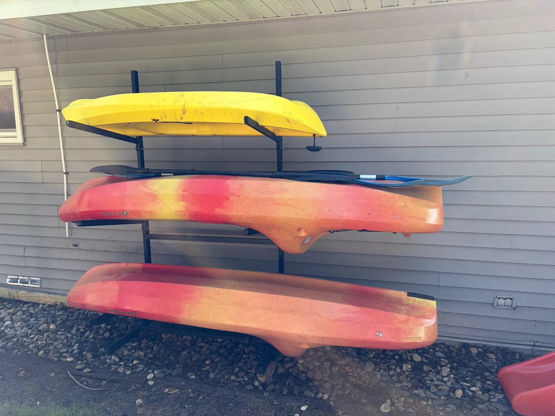 Kayaks - storage on the side of the house